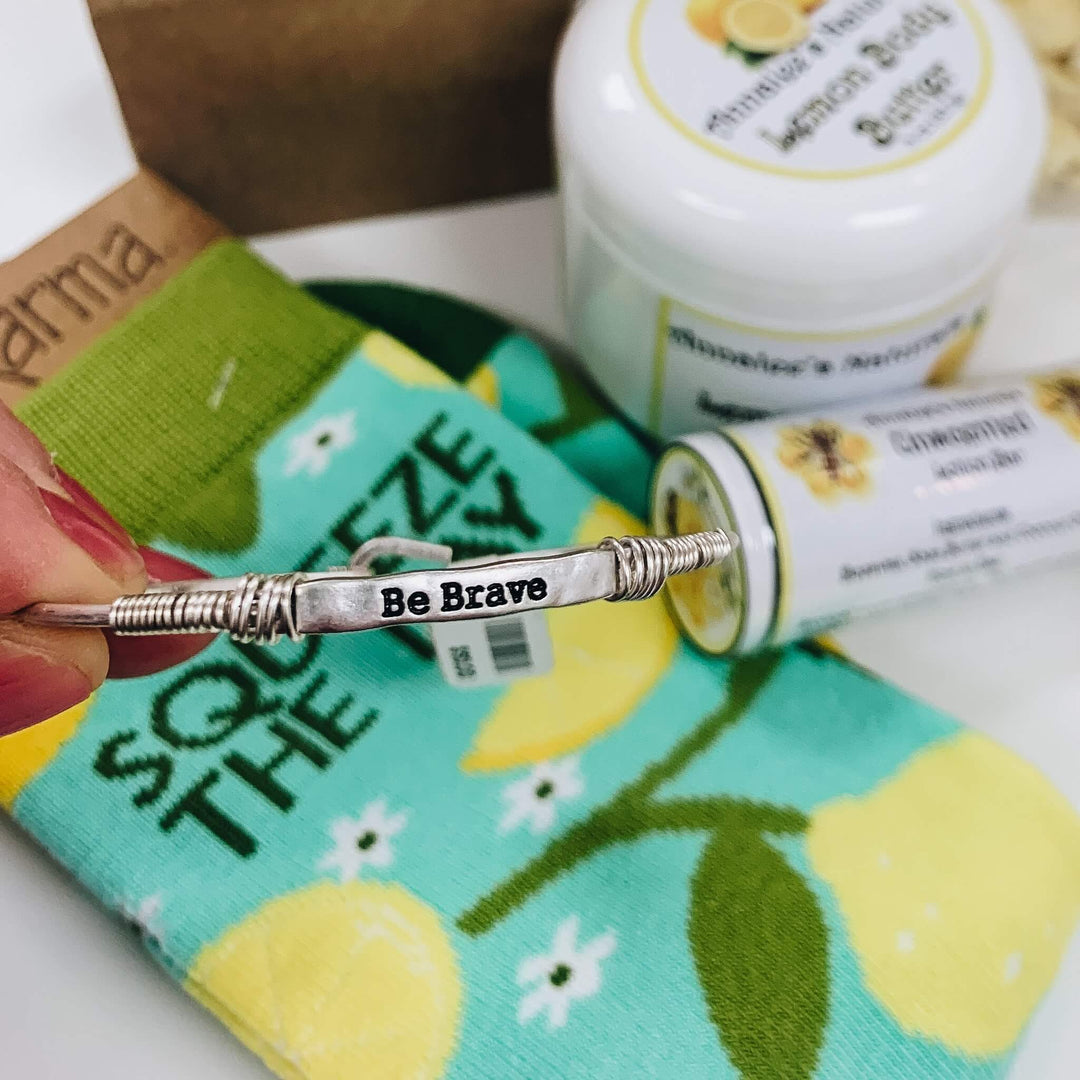 Silver "Be Brave" bracelet that was included in a 2021 Curate Gift Box order in Centennial, Colorado from Curate Mercantile.